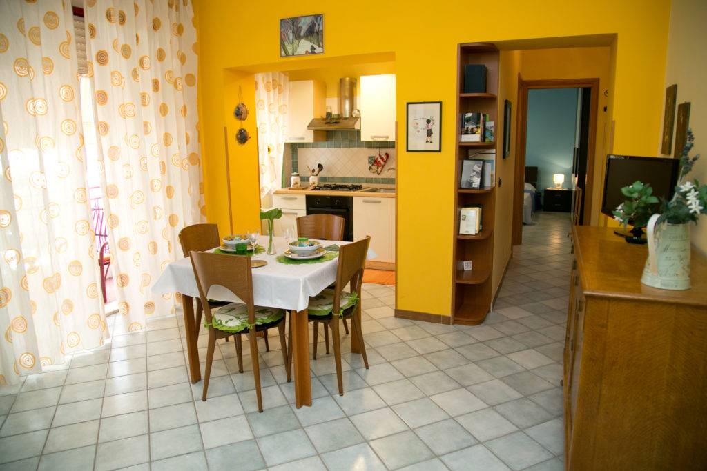 Open Space Orange Zona giorno Appartamenti Letojanni Casa Putti Arancio